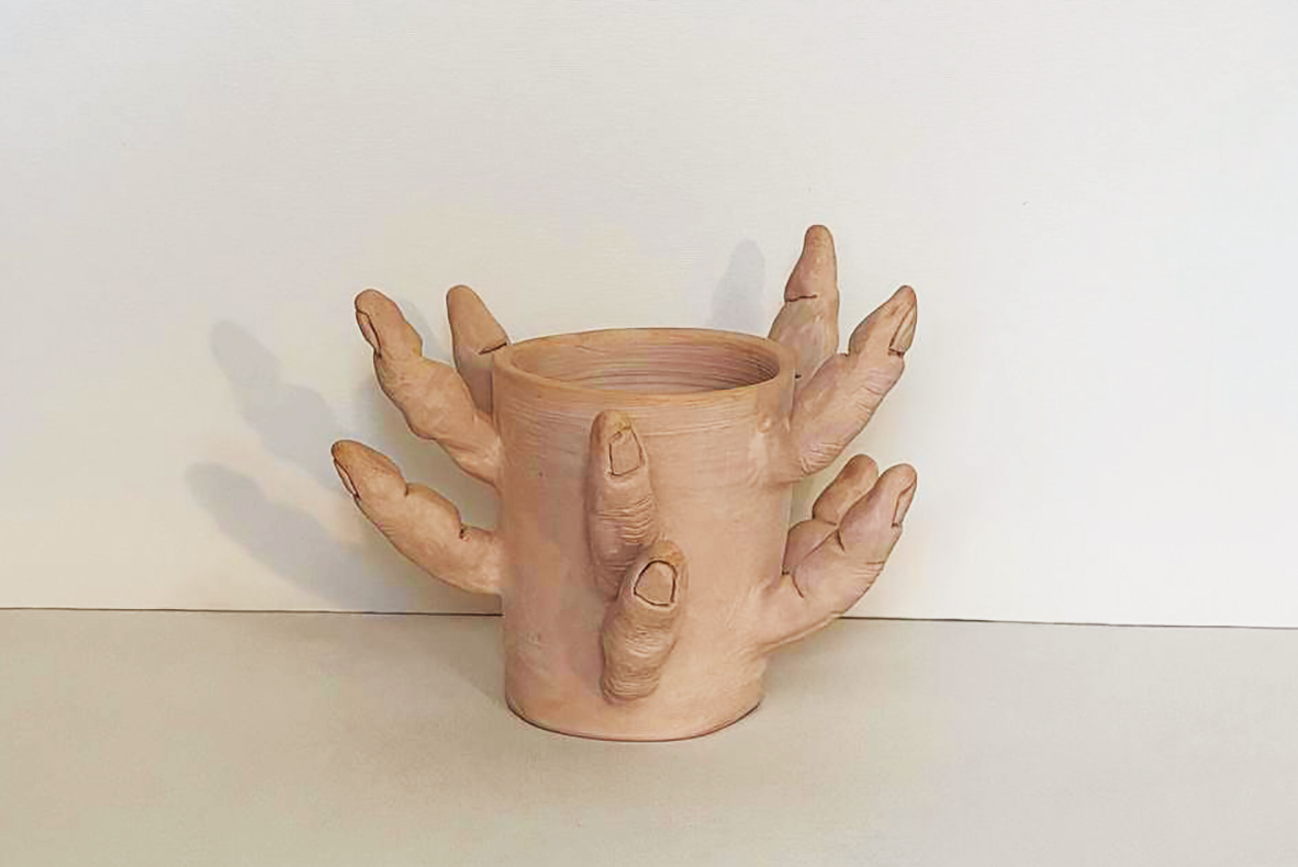 Severed fingers, ceramic cylinder ringed with outstretched hands and fingers
