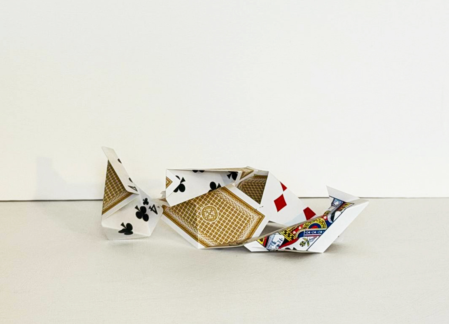Cut Playing Cards, an elongated ridge of folded cards