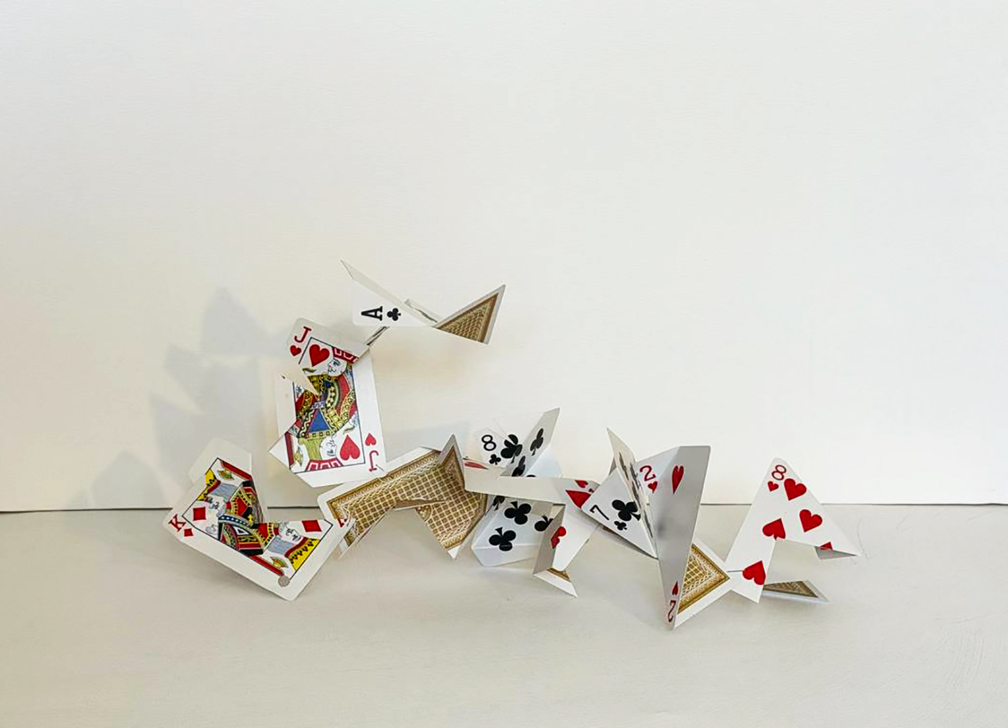 Cut Playing Cards, a larger sprawling construction of folded court cards