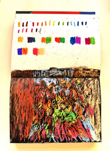 Sketchbook opened to swatches of colour tests