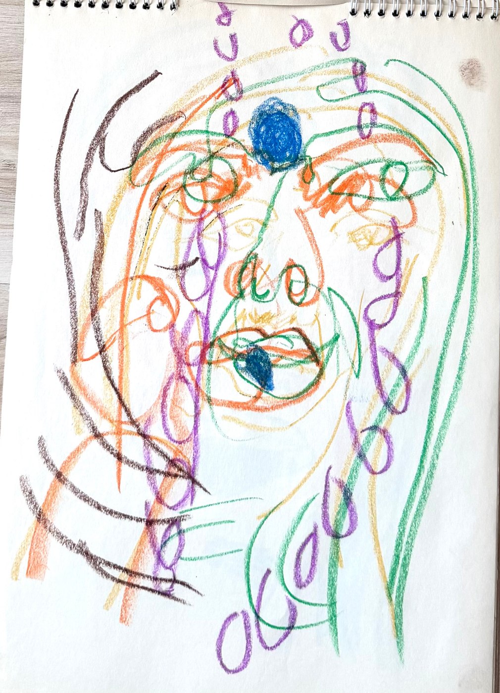 Self-portrait study in oil pastel, a face built from looping green, purple and orange line